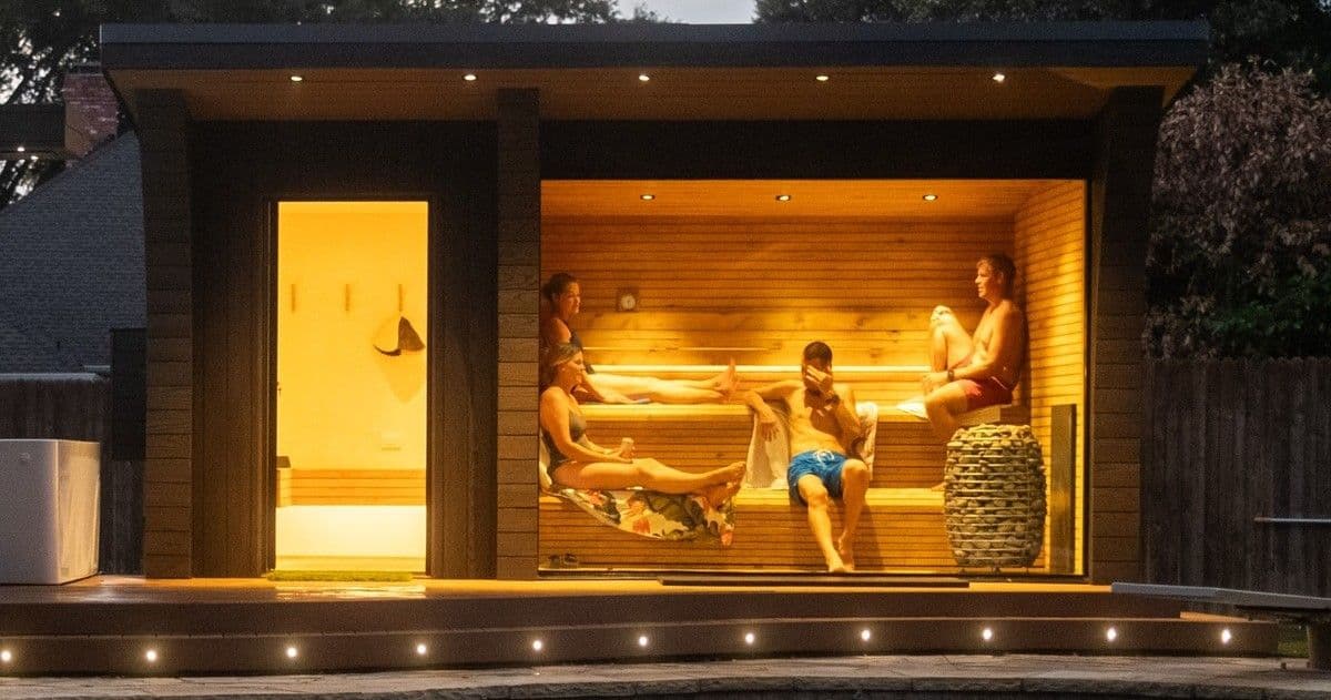 People relaxing in traditional sauna People relaxing in traditional sauna